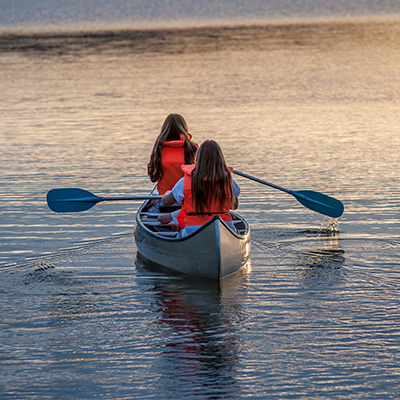 Two girls canoeing